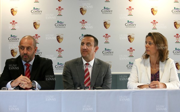 090812 - Welsh Rugby Union Announcement -Rupert Moon (centre) who has been named  WRU General Manager of the North Wales Development Region with WRU head of Rugby Joe Lydon and Sasha Davies of Conwy Council during a press conference