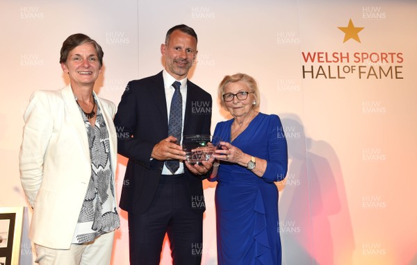 260619 - Welsh Sport Hall of Fame - Ryan Giggs receives his award from Laura Mcallister and Esmee Allchurch after being inducted into the Welsh Sport Hall of Fame