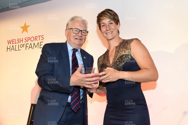 260619 - Welsh Sport Hall of Fame - Michaela Breeze receives her award from Lord Dafydd Elis-Thomas after being inducted into the Welsh Sport Hall of Fame