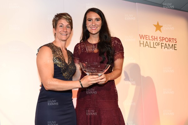 260619 - Welsh Sport Hall of Fame - Jazz Carlin (right) receives her award from Michaela Breeze after being inducted into the Welsh Sport Hall of Fame