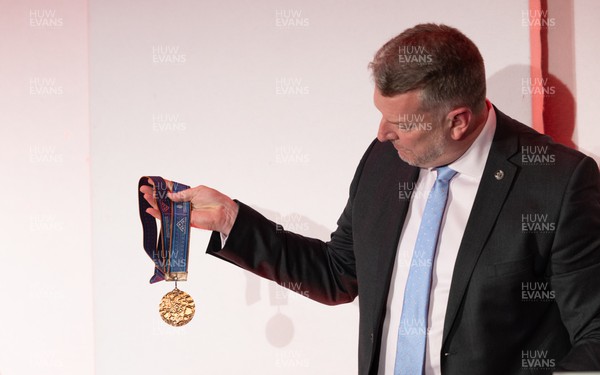 140923 - Welsh Sports Hall of Fame Dinner, Cardiff City Stadium - Simon Richards, father of champion swimmer Matt Richards, displays some of his medals