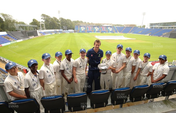 110817 - Welsh Clubs U15 Cup Final - Jac Kennedy, captain of Northop Hall U15 recieves the trophy from Glamorgan capatin Michael Hogan