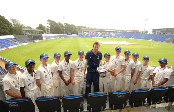 110817 - Welsh Clubs U15 Cup Final - Jac Kennedy, captain of Northop Hall U15 recieves the trophy from Glamorgan capatin Michael Hogan