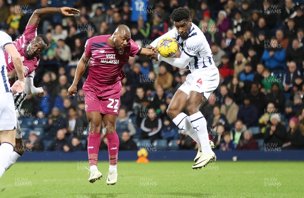 130224 - West Bromwich Albion v Cardiff City - Sky Bet Championship - Yakou Meite of Cardiff tries to head in a goal but is thwarted by Cedric Kipre of West Bromwich Albion
