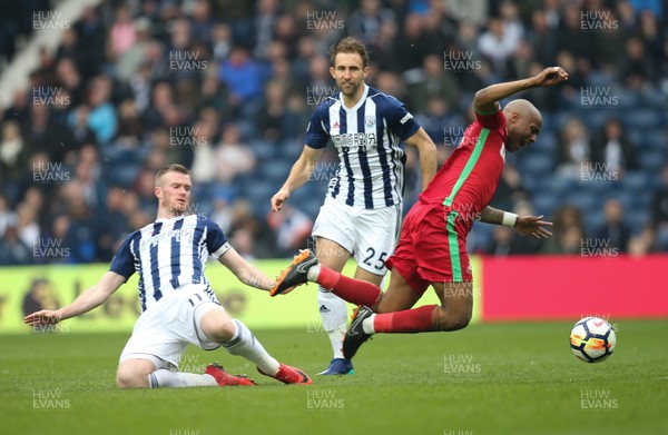 070418 - West Bromwich Albion v Swansea City, Premier League - Andre Ayew of Swansea City is brought down by Chris Brunt of West Bromwich Albion