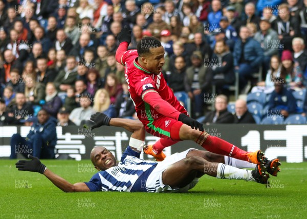 070418 - West Bromwich Albion v Swansea City, Premier League - Martin Olsson of Swansea City is brought down by Allan Nyom of West Bromwich Albion