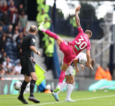 120823 - West Bromwich Albion v Swansea City - Sky Bet Championship - Harrison Ashby falls over Conor Townsend of West Bromwich Albion in 2nd half