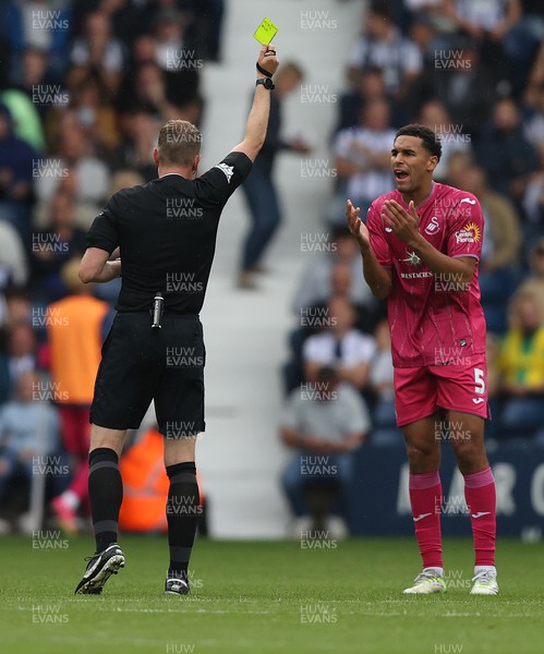 120823 - West Bromwich Albion v Swansea City - Sky Bet Championship - Ben Cabango of Swansea is given a yellow card by referee Samuel Barrott