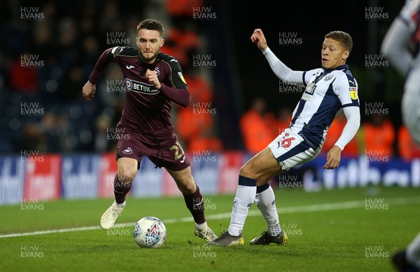 130319 - West Bromwich Albion v Swansea City - SkyBet Championship - Matt Grimes of Swansea City is challenged by Dwight Gayle of West Bromwich Albion