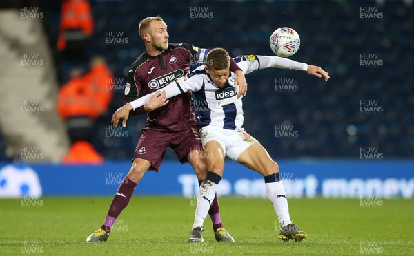 130319 - West Bromwich Albion v Swansea City - SkyBet Championship - Dwight Gayle of West Bromwich Albion is challenged by Mike van der Hoorn of Swansea City
