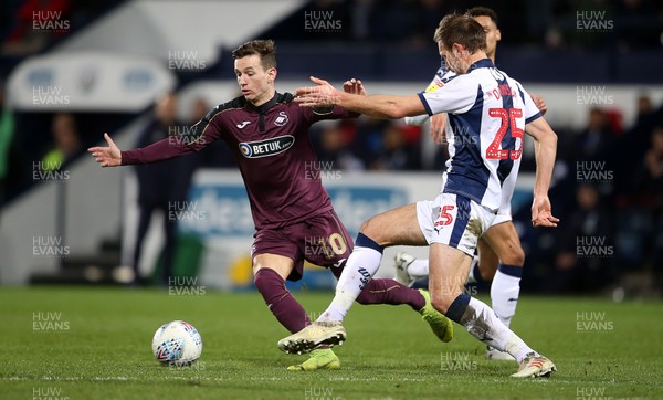 130319 - West Bromwich Albion v Swansea City - SkyBet Championship - Bersant Celina of Swansea City is challenged by Craig Dawson of West Bromwich Albion