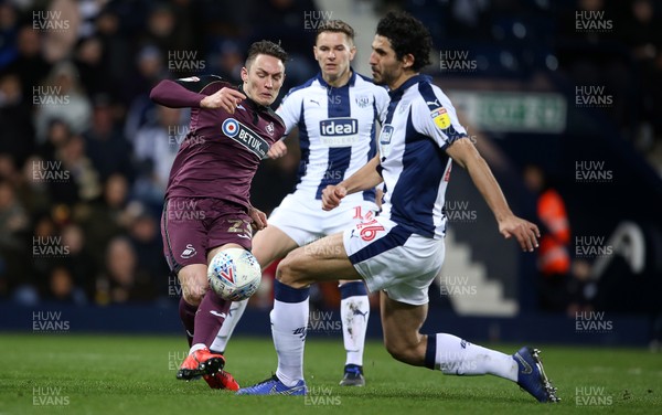 130319 - West Bromwich Albion v Swansea City - SkyBet Championship - Connor Roberts of Swansea City is tackled by Ahmed Hegazy of West Bromwich Albion before he can have a shot at goal