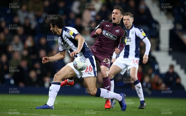 130319 - West Bromwich Albion v Swansea City - SkyBet Championship - Connor Roberts of Swansea City is tackled by Ahmed Hegazy of West Bromwich Albion before he can have a shot at goal
