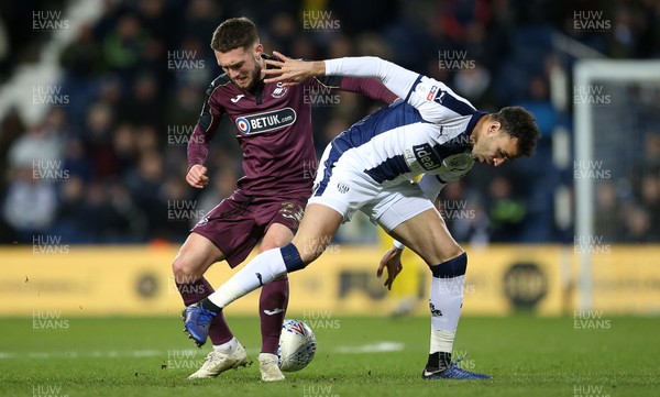 130319 - West Bromwich Albion v Swansea City - SkyBet Championship - Matt Grimes of Swansea City is tackled by Hal Robson-Kanu of West Bromwich Albion