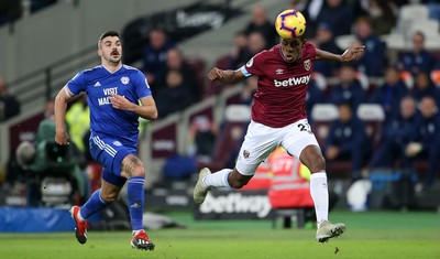 041218 - West Ham United v Cardiff City - Premier League - Issa Diop of West Ham gets to the ball quicker than Callum Paterson of Cardiff City