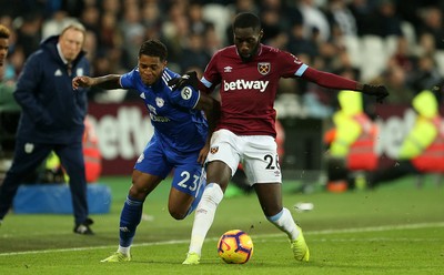 041218 - West Ham United v Cardiff City - Premier League - Kadeem Harris of Cardiff City is tackled by Arthur Masuaku of West Ham