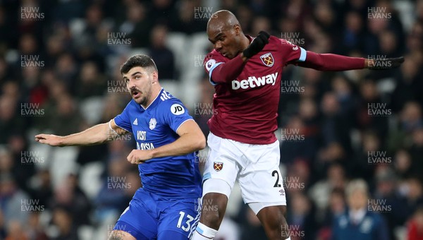 041218 - West Ham United v Cardiff City - Premier League - Callum Paterson of Cardiff City and Angelo Ogbonna of West Ham go up for the ball
