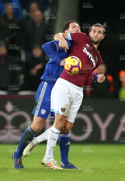 041218 - West Ham United v Cardiff City - Premier League - Sean Morrison of Cardiff City battles with Andy Carroll of West Ham