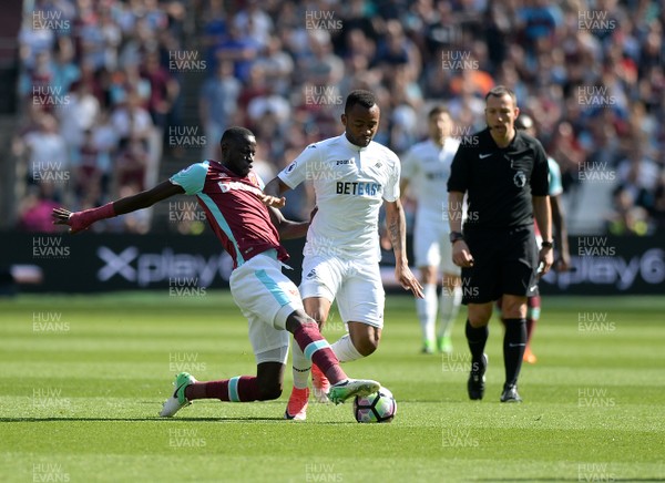 080417 - West Ham United v Swansea City - Premier League  -   Cheikhou Kouyate of West Ham tackles Swanseas Jordan Ayew  