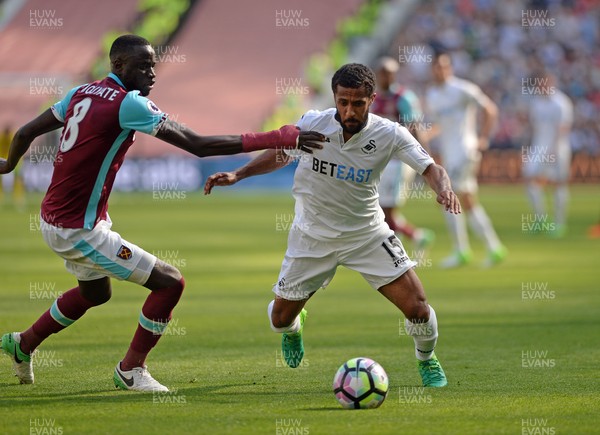 080417 - West Ham United v Swansea City - Premier League  -   Wayne Routledge of Swansea goes past Cheikhou Kouyate of West Ham  