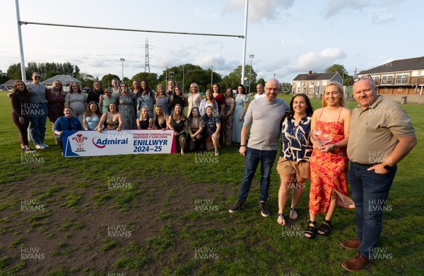 070625 - West Swansea Hawks - Sue Jones captain of West Swansea Hawks with the League Trophy, along with coaches Keith Pritchard, Rhiannon Sheen de Jesus and Andrew Steele as the team celebrate winning the Admiral Women’s West League Title