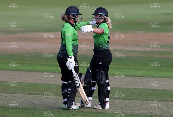 250821 - Western Storm v The Thunder - Charlotte Edwards Cup - Georgia Hennessy and Katie George celebrate after winning the game