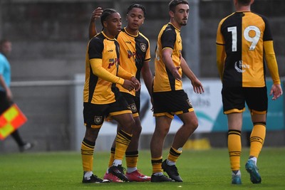 150725 - Weston-Super-Mare v Newport County - Preseason Friendly - Moses-Alexander Walker of Newport County scores the first goal of the game and celebrates with Armani Babah