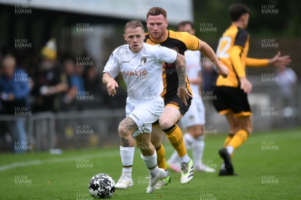 150725 - Weston-Super-Mare v Newport County - Preseason Friendly - James Waite of Weston Super-Mare is challenged by Lee Jenkins of Newport County