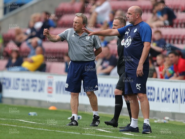 030819 - Wigan Athletic v Cardiff City - Sky Bet Championship - Manager Neil Warnock of Cardiff and Manager Paul Cook of Wigan Athletic in the technical area urging their teams on 