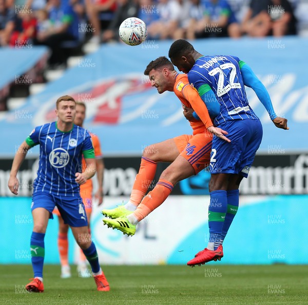 030819 - Wigan Athletic v Cardiff City - Sky Bet Championship - Gary Madine of Cardiff and Chey Dunkley of Wigan Athletic 