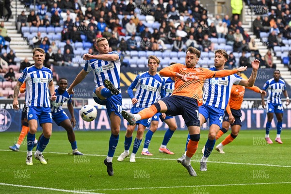 270925 - Wigan Athletic v Cardiff City - Sky Bet League 1 -  Calum Chambers of Cardiff City and Paul Mullin of Wigan Athletic battle for the ball