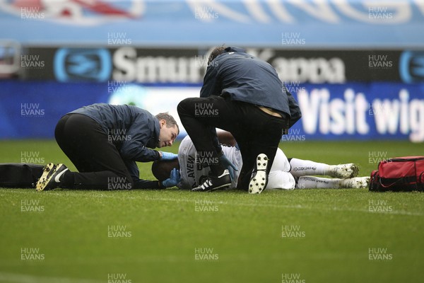 021119 - Wigan Athletic v Swansea City - Sky Bet Championship - Andre Ayew of Swansea lies injured 