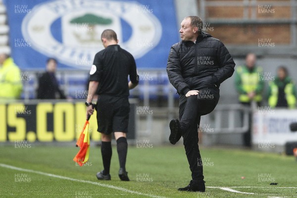 021119 - Wigan Athletic v Swansea City - Sky Bet Championship - Manager Steve Cooper  of Swansea air kicks the ball during the match 