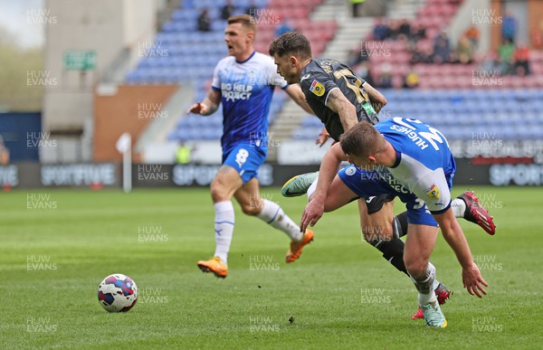 100423 - Wigan Athletic v Swansea City - Sky Bet Championship - Jamie Paterson of Swansea is felled by Charlie Hughes of Wigan Athletic in the penalty area