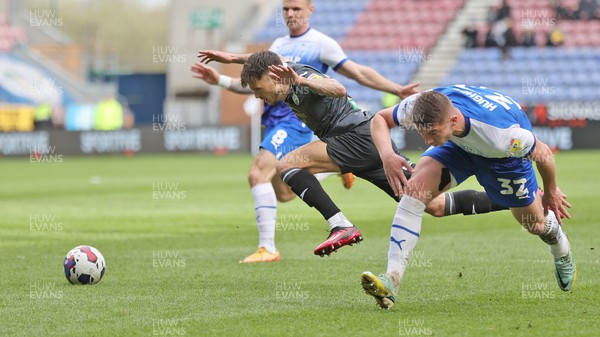 100423 - Wigan Athletic v Swansea City - Sky Bet Championship - Jamie Paterson of Swansea is felled by Charlie Hughes of Wigan Athletic in the penalty area