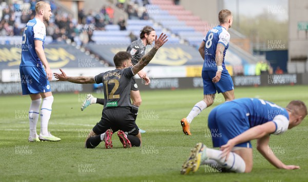 100423 - Wigan Athletic v Swansea City - Sky Bet Championship - Jamie Paterson of Swansea is felled by Charlie Hughes of Wigan Athletic and appeals for a penalty which is not given