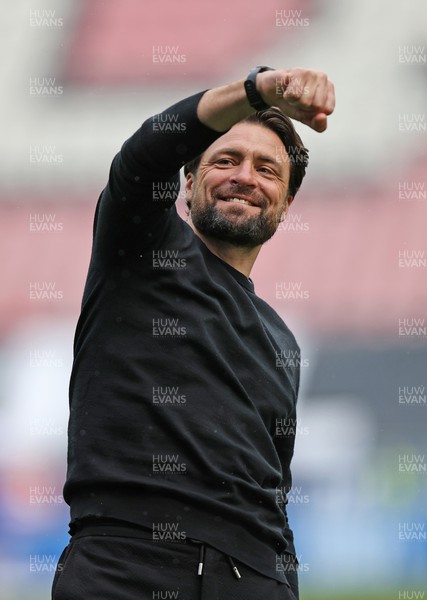 100423 - Wigan Athletic v Swansea City - Sky Bet Championship - Head Coach Russell Martin  of Swansea at the end of the match applauds the fans