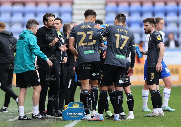 100423 - Wigan Athletic v Swansea City - Sky Bet Championship - Head Coach Russell Martin  of Swansea talks to the team during a break in the play