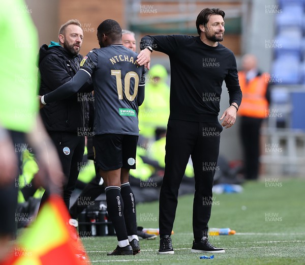 100423 - Wigan Athletic v Swansea City - Sky Bet Championship - Head Coach Russell Martin  of Swansea pats Olivier Ntcham of Swansea as he is subbed