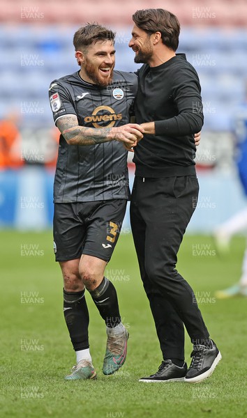 100423 - Wigan Athletic v Swansea City - Sky Bet Championship - Head Coach Russell Martin  of Swansea and Ryan Manning  of Swansea at the end of the match