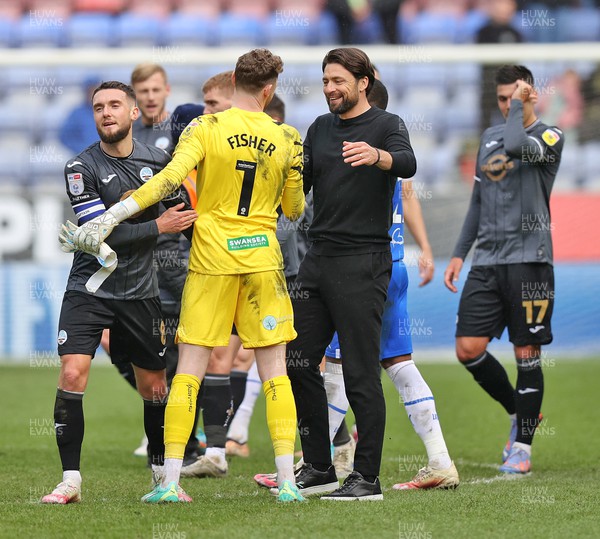 100423 - Wigan Athletic v Swansea City - Sky Bet Championship - Head Coach Russell Martin  of Swansea greets Goalkeeper Andy Fisher  of Swansea at the end of the match