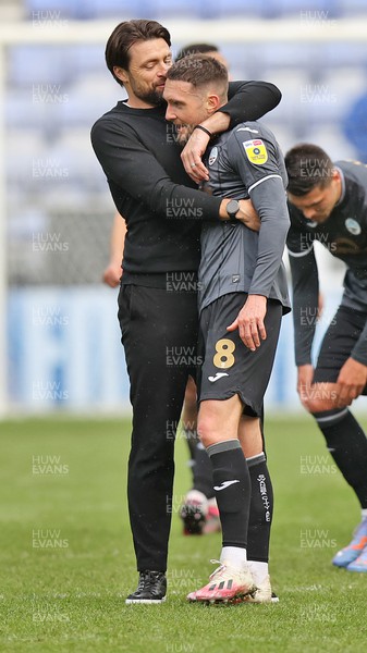 100423 - Wigan Athletic v Swansea City - Sky Bet Championship - Head Coach Russell Martin  of Swansea kisses Matt Grimes of Swansea at the end of the match