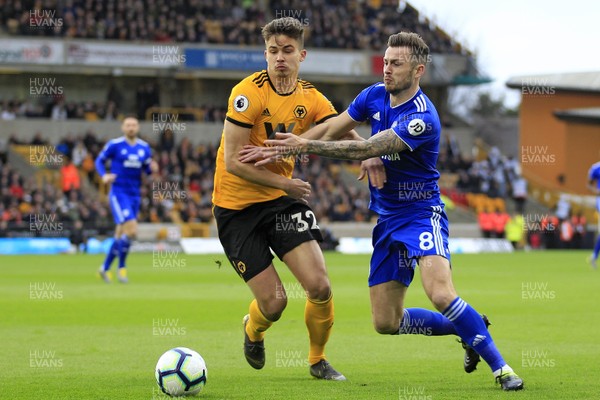 020319 - Wolverhampton Wanderers v Cardiff City, Premier League - Joe Ralls of Cardiff City (right) and Leander Dendoncker of Wolverhampton Wanderers battle for the ball