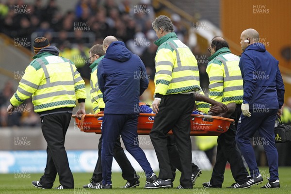 020319 - Wolverhampton Wanderers v Cardiff City, Premier League - Sol Bamba of Cardiff City is taken from the pitch on a stretcher after sustaining an injury