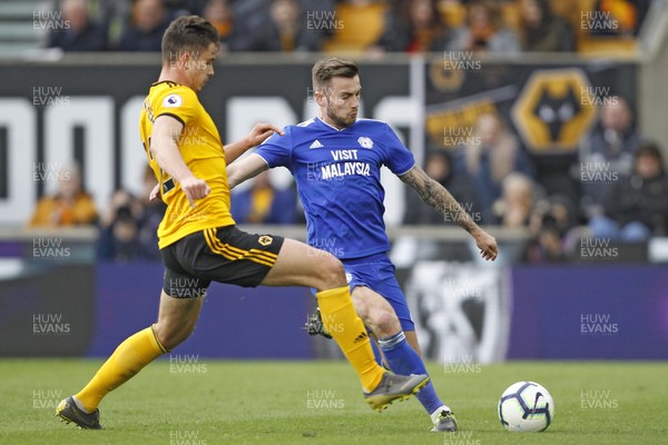 020319 - Wolverhampton Wanderers v Cardiff City, Premier League - Joe Ralls of Cardiff City (right) in action with Leander Dendoncker of Wolverhampton Wanderers