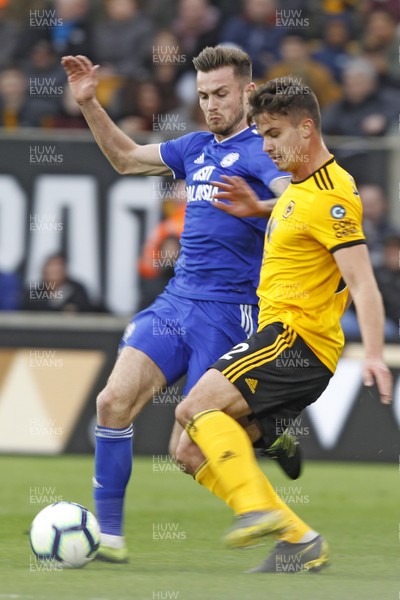 020319 - Wolverhampton Wanderers v Cardiff City, Premier League - Joe Ralls of Cardiff City (left) and Leander Dendoncker of Wolverhampton Wanderers battle for the ball