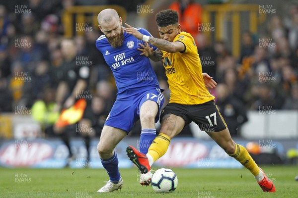 020319 - Wolverhampton Wanderers v Cardiff City, Premier League - Aron Gunnarsson of Cardiff City (left) and Morgan Gibbs-White of Wolverhampton Wanderers battle for the ball