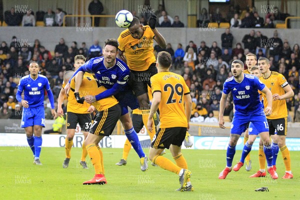 020319 - Wolverhampton Wanderers v Cardiff City, Premier League - Willy Boly of Wolverhampton Wanderers (centre right) out jumps Sean Morrison of Cardiff City