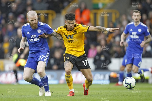 020319 - Wolverhampton Wanderers v Cardiff City, Premier League - Aron Gunnarsson of Cardiff City (left) in action with Morgan Gibbs-White of Wolverhampton Wanderers