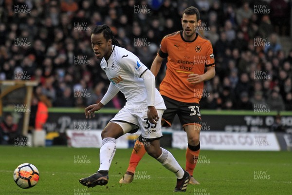 060118 - Wolverhampton Wanderers v Swansea City, FA Cup Third Round - Renato Sanches of Swansea City (left) in action with Will Norris of Wolverhampton Wanderers